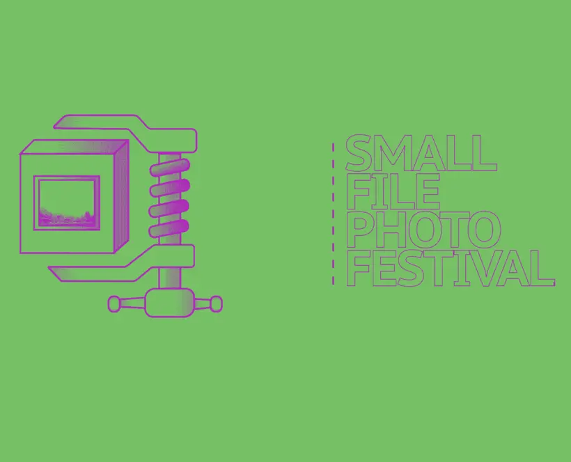 A clamp holding box that contains a photograph of landscape. "Small File Photo Festival"