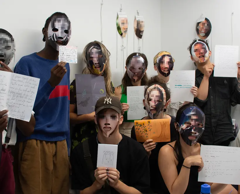 A group of people with masks of pixelated faces